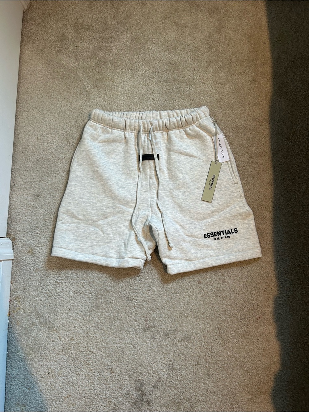 Fear of God essentials shorts light oatmeal size Small